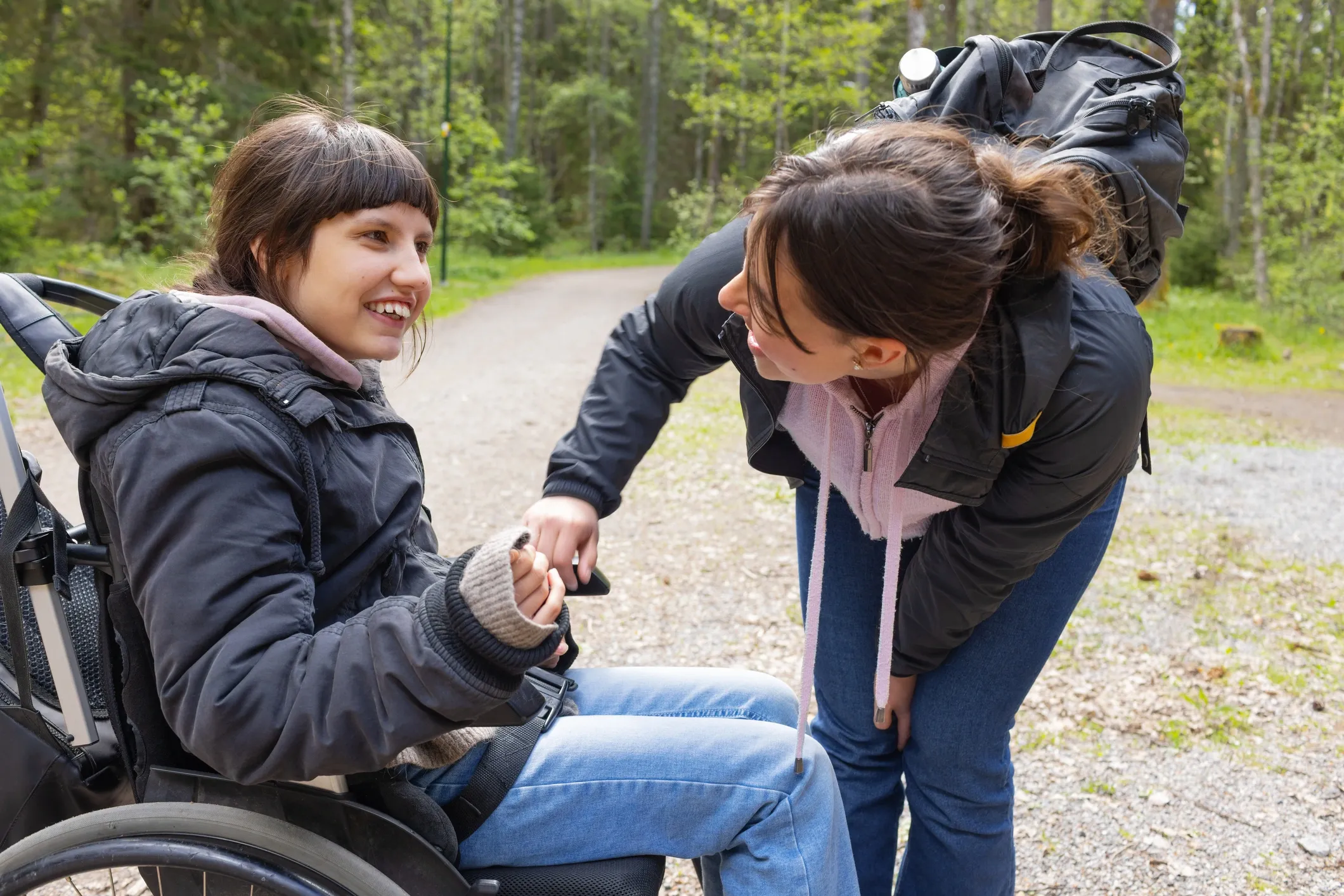 A participant and caregiver spending time together outdoors